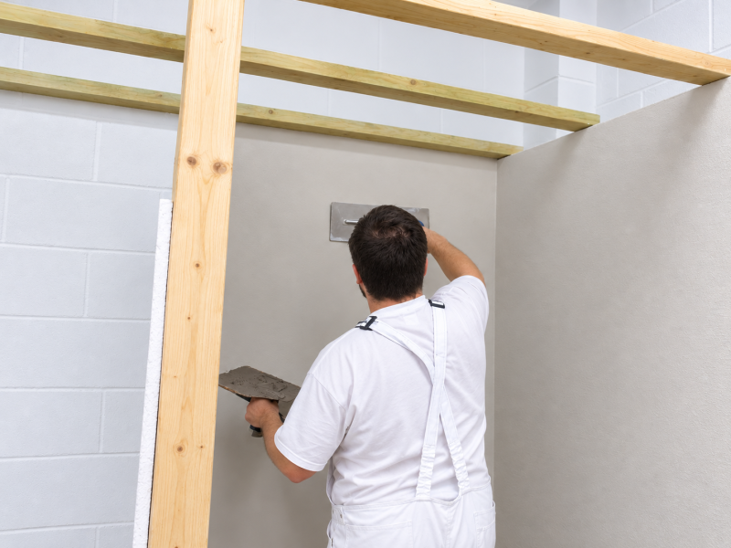 person plastering