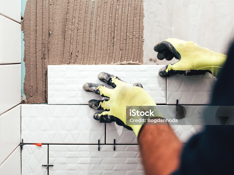 Ceramic tiles being applied