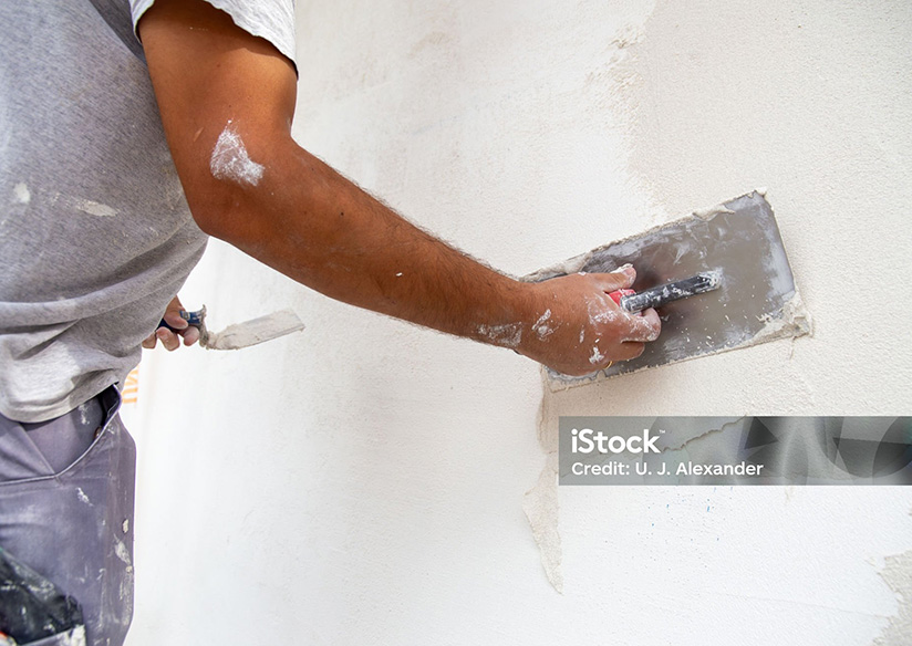 man plastering